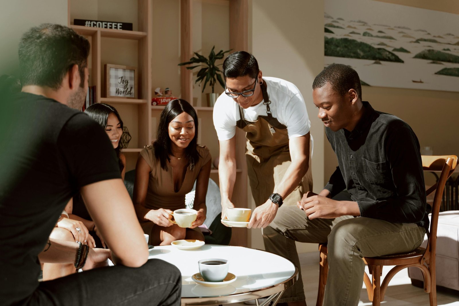 Waiter serves Coffee on Table